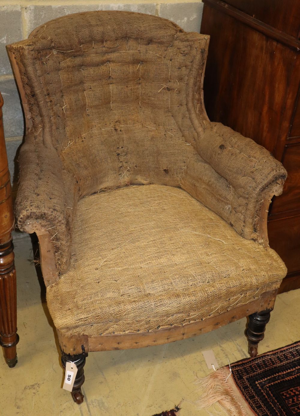 A Napoleon III ebonised armchair